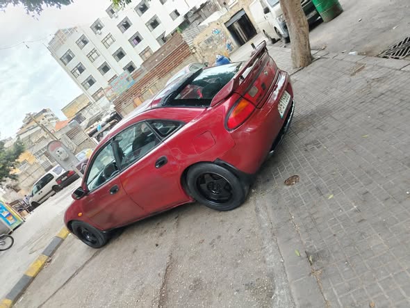 مازدا 323 1996 - صورة 2