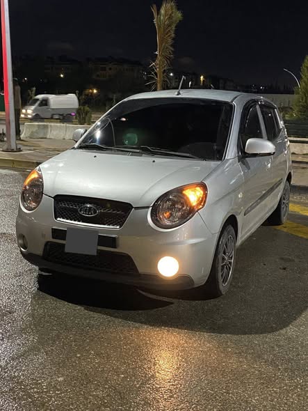 كيا مورنيج 2010 - صورة 3