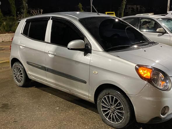 كيا مورنيج 2010 - صورة 4