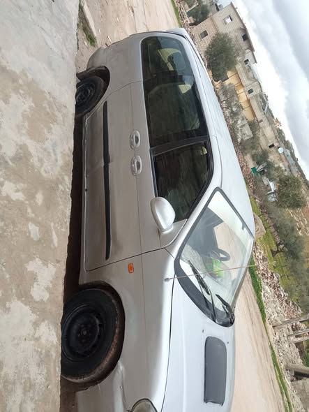 كيا كرنفال 2001 - صورة 4