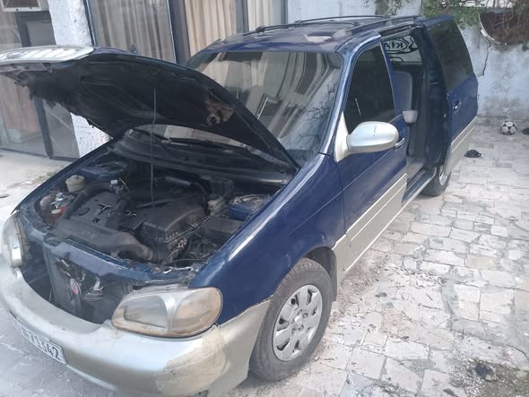 كيا كرنفال 2002 - صورة 2