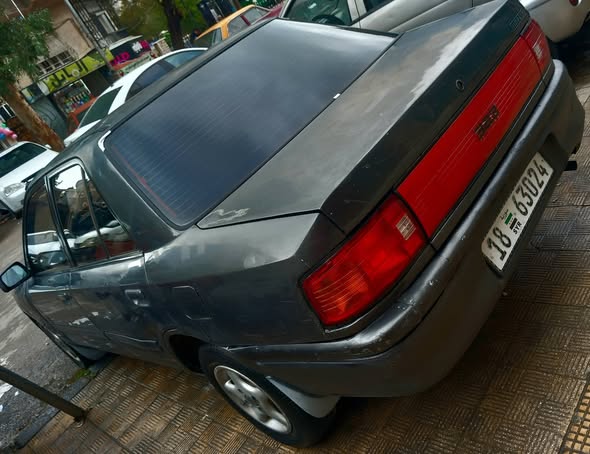 مازدا 323 1993 - صورة 2