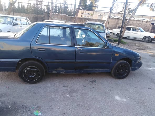 مازدا 323 1993 - صورة 3