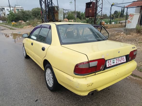 بروتون ويرا 2004 - صورة 1