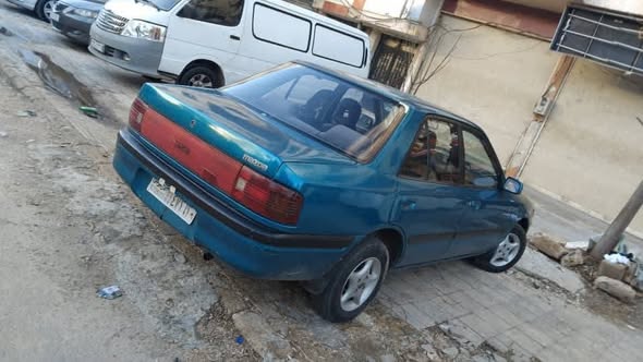 مازدا ٣٢٣ 1993 - صورة 3