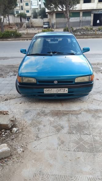 مازدا ٣٢٣ 1993 - صورة 4