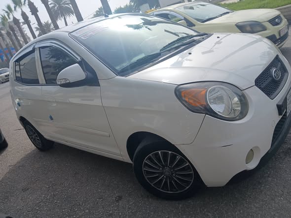 كيا مورنيغ 2011 - صورة 2