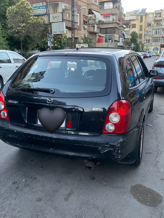 مازدا 323 2003
