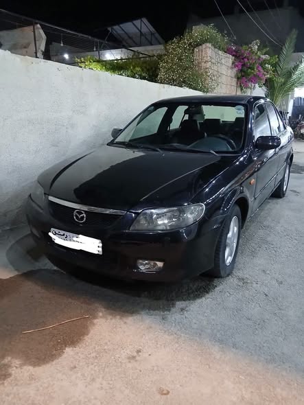 مازدا 323 2003 - صورة 1