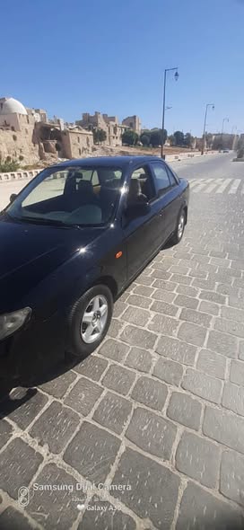 مازدا 323 2002 - صورة 1