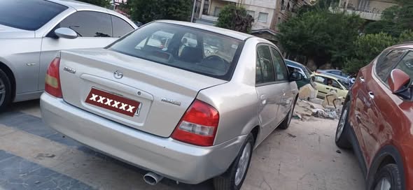 مازدا 323 2002 - صورة 1