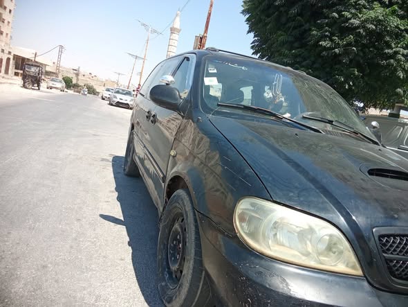 كيا كرنفال 2005 - صورة 4