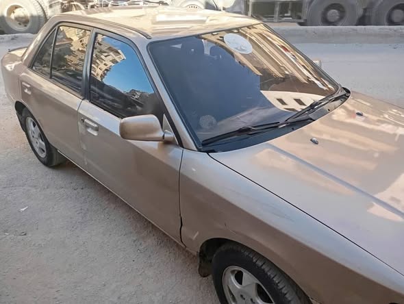 مازدا 323 1993 - صورة 3