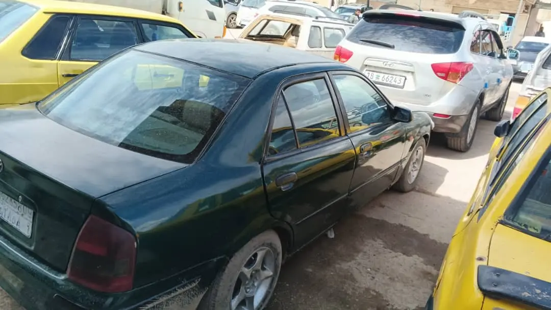 مازدا 2002 - سيارة اقتصادية مطلوب 2700 وبازار على ارض الواقع  - صورة 3